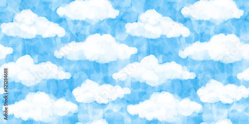 Seamless white puffy watercolor clouds on bright blue sky background pattern. Tileable hand painted digital gouache cartoon cloud texture. Abstract summer day landscape wallpaper or backdrop.. photo