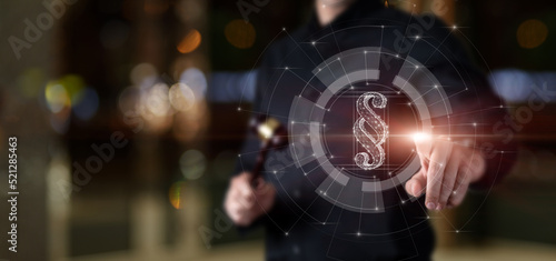 A lawyer with a judge gavel in his hands clicks on a paragraph .