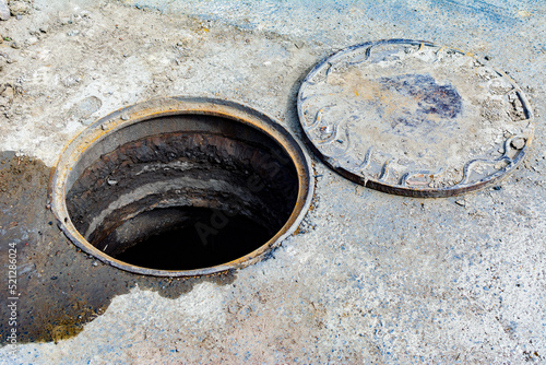 Open manhole.Repair work in the sewer well