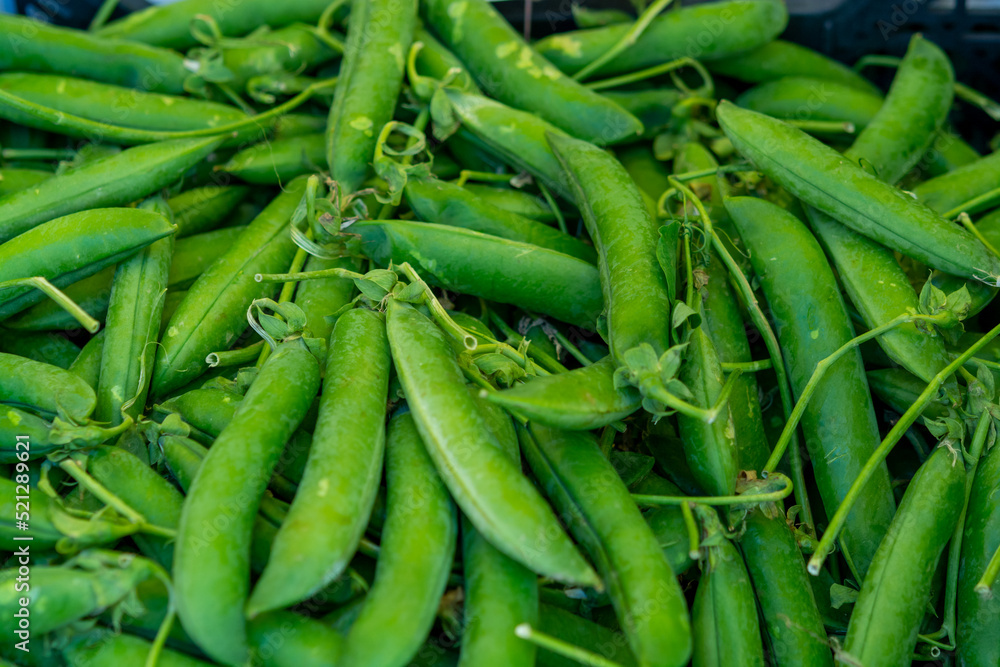 Sweet green pea pods for sale on Polish farmers market Sweet green pea pods for sale on Polish farmers market