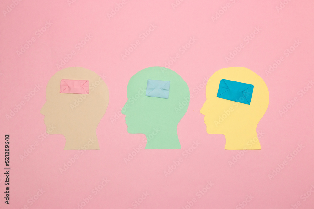 three colorful paper heads with envelope and letter instead of brain, creative art design
three colorful paper heads with envelope and letter instead of brain, creative art design