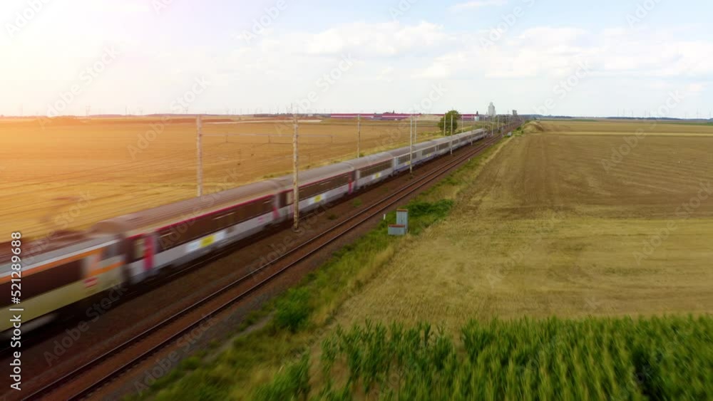 Modern high speed train. Electric passenger train. Very fast driving. journey and travel concept. Aerial footage of a high speed passenger train in the countryside. highspeed train railroad track. Modern high speed train. Electric passenger train. Very fast driving. journey and travel concept. Aerial footage of a high speed passenger train in the countryside. highspeed train railroad track.