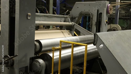 winding of a roll of technical paper on the timelapse paper mill line