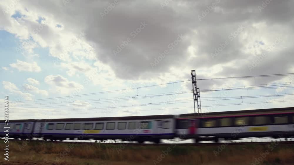 Modern high speed train. High speed passenger railway train. Passenger train running in the countryside. Modern high speed train. High speed passenger railway train. Passenger train running in the countryside.