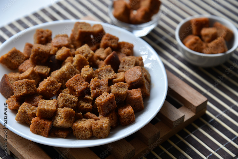 Spicy and spiced breadcrumbs on a white plate close-up.
