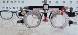 Selection of glasses and optics at ophthalmologist closeup