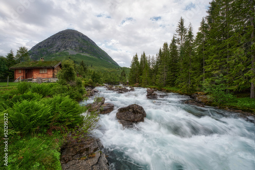 A small mountain waterfall,  Billingen village, Central Norway photo