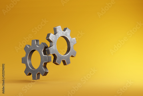 Tableau sur toile Interlocking gears isolated on yellow background
