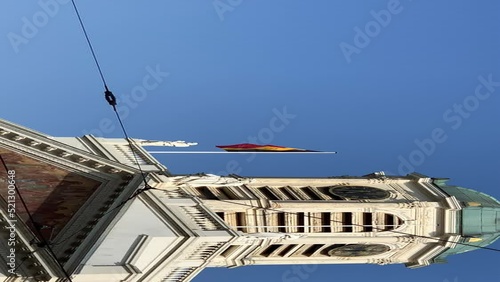 Belgium flag fluttering on top of the tower of the Place Royale photo