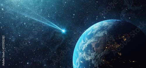 Comet, asteroid, meteorite flying to the planet Earth.  Glowing asteroid and tail of a falling comet threatening the safety of the Earth.  Elements of this image furnished by NASA.
