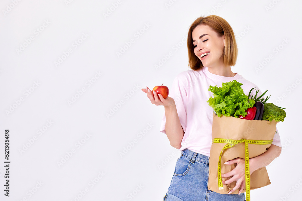 caucasian woman hold paper bag with vegetables caucasian woman hold paper bag with vegetables