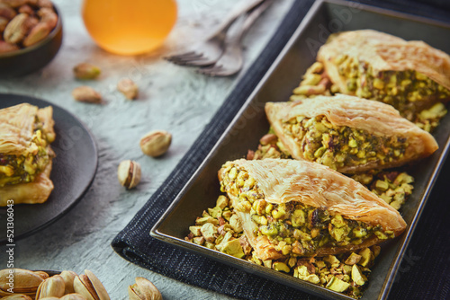 Arabic Cuisine; Traditional Arabic Dessert "Warbat" or "Shaabiyat" It is an Arabic sweet pastry similar to Baklava. It consisting of layers phyllo dough filled with crushed pistachios.