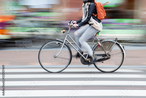 woman rides a bicycle in the city