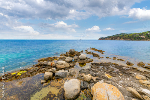The Mediterranean Sea along the rocky Costa Brava coast at the Spanish town of Calella de Palafrugell, Spain.