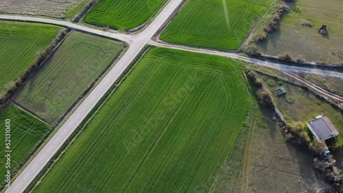 aerial footage of a long road in the country photo