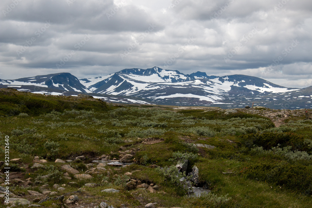 The view of Sylarna Massif from the hiking trail between Sylarna and Helags mountain stations in early July, Jamtland, Sweden