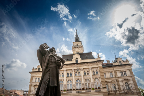 Trg Slobode Square with the city hall, or Gradska Kuca, and the Svetozar Miletic statue created in 1935 by Ivan mestrovic in novi sad, second biggest city of Serbia photo