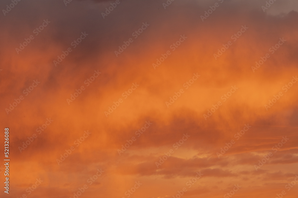 Puffy Orange Clouds Reflect Sunset LIght Puffy Orange Clouds Reflect Sunset LIght