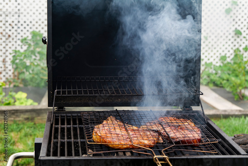 food  craft and delicious concept - cooking T-bone steak on a grill. High quality photo