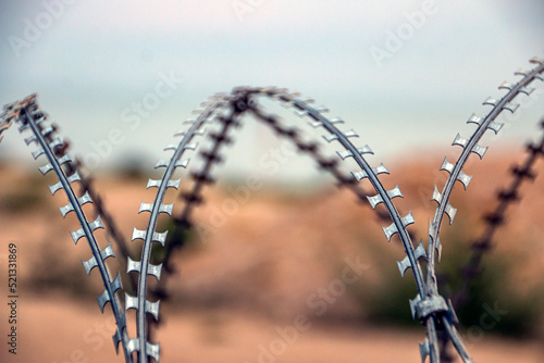 Barbed wire at the entrance to the sea beach during the war in Ukraine