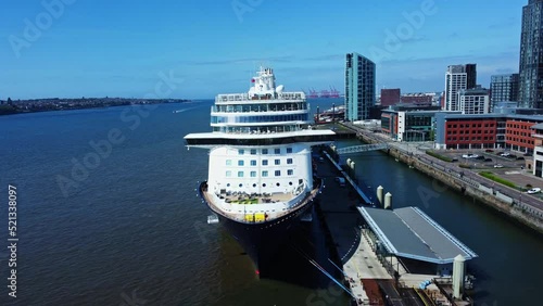 Aerial shot of a cruise ship in Liverpool pierhead with a cityscape photo