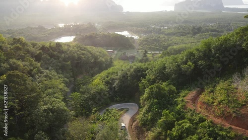 Aerial view of countryside and car on road pan to beautiful view of smed nang she phang nga photo