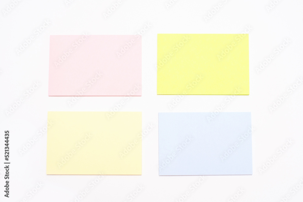Mock-up of many empty multicolored office stickers on a white background.