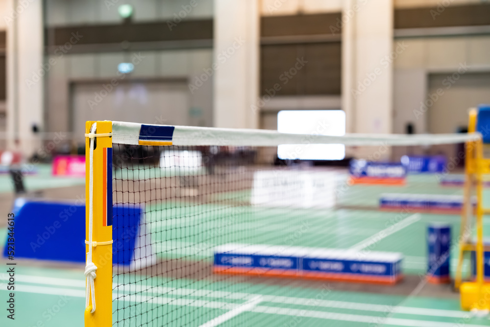 Naklejka premium badminton net Close up shot of a used in court with blurred background in sports stadium.