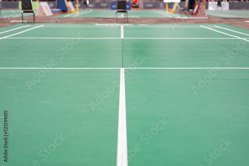 empty green used badminton court background is ready for playing badminton in competition or exercise for being healthy.