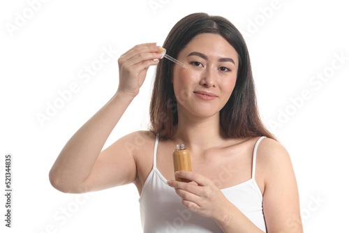 Young Asian woman with cosm...