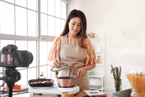 Young Asian woman boiling p...