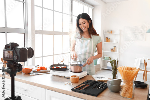 Young Asian woman boiling p...