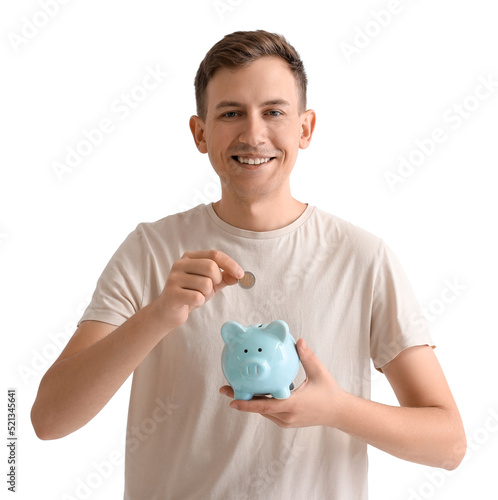 Young man putting coin into...