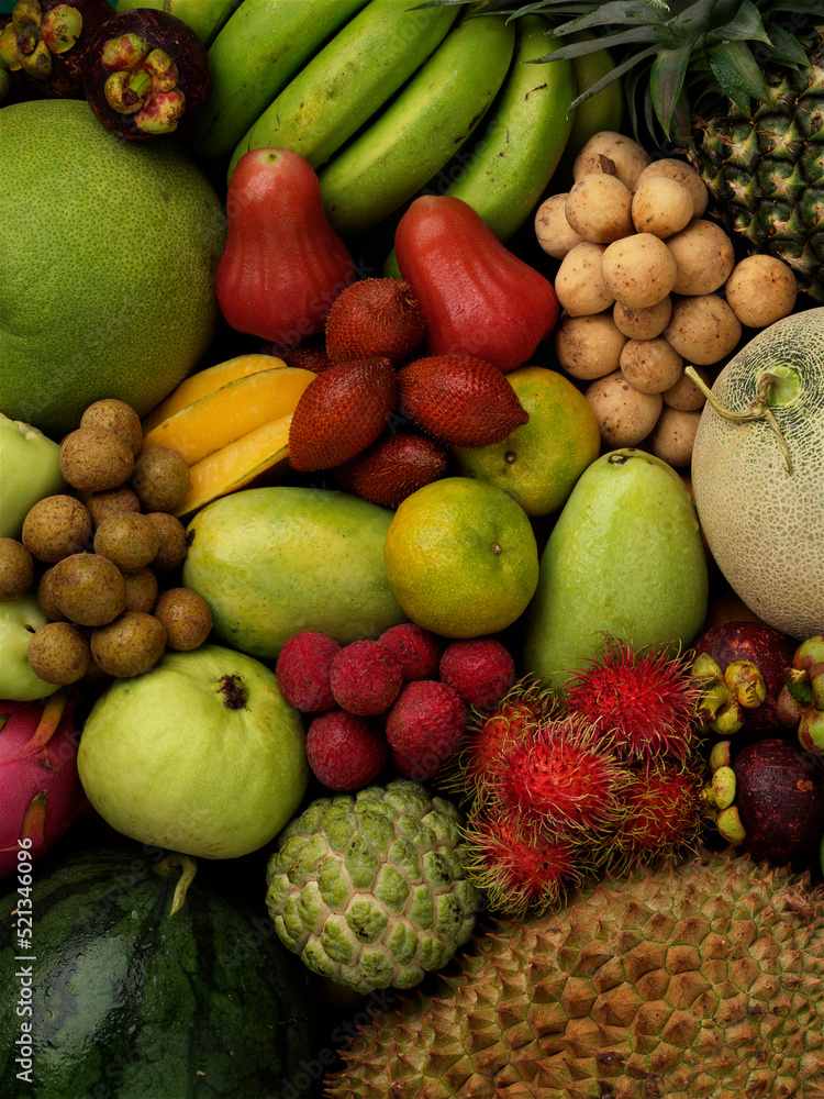 Assortment of Tropical fruits background.