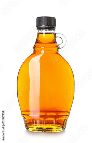 Bottle of maple syrup on white background