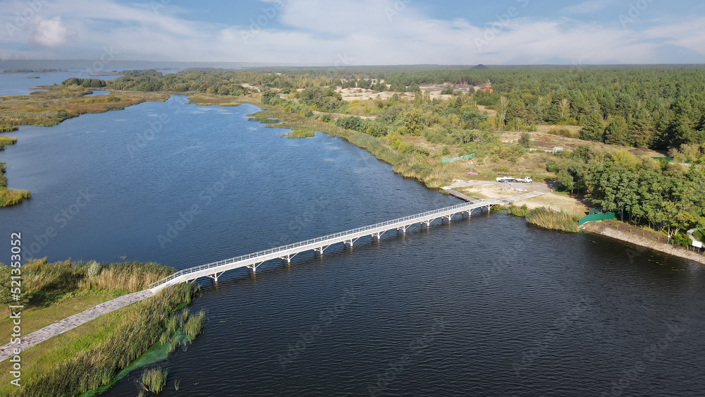 Top view of the pedestrian bridge to the island across the Dnieper River Top view of the pedestrian bridge to the island across the Dnieper River