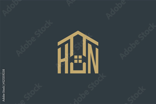 Initial HN logo with abstract house icon design, simple and elegant real estate logo design