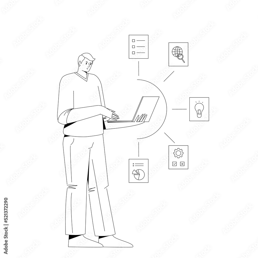 A man works at a computer while standing. A man works at a computer while standing.