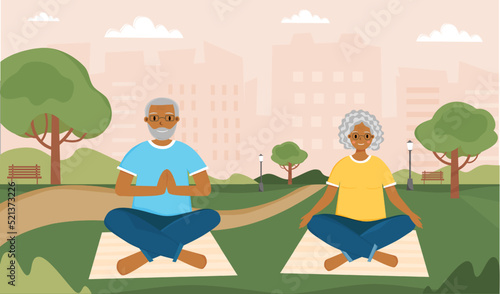 Senior American people practicing Yoga and Meditation in city Park. Pensioners Workout in City Park, Yoga for Elderly People. Concept of active healthy lifestyle for senior people.