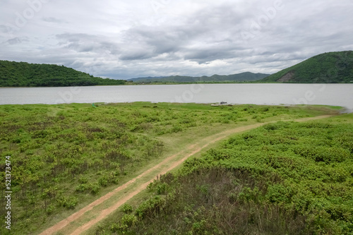 Top view from a drone of the reservoir at Huai Phak Reservoir, Tha Yang District, Phetchaburi, Thailand. © Around Ball
