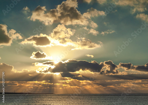 Canvas Print Atlantic coast dramatic sky with sunbeams through clouds at sunset Gironde estua