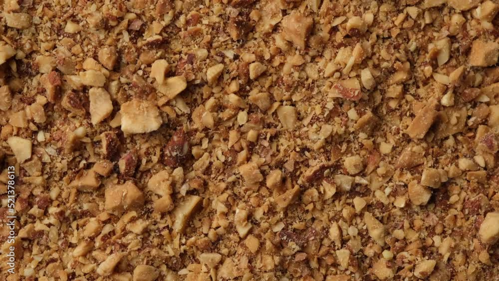 Ground Almond nuts close up. Crushed Almond kernels rotating Ground Almond nuts close up. Crushed Almond kernels rotating