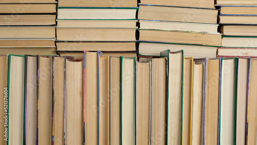 Stacks of books in library. Textbooks for education, learning, gaining knowledge at school, college or university