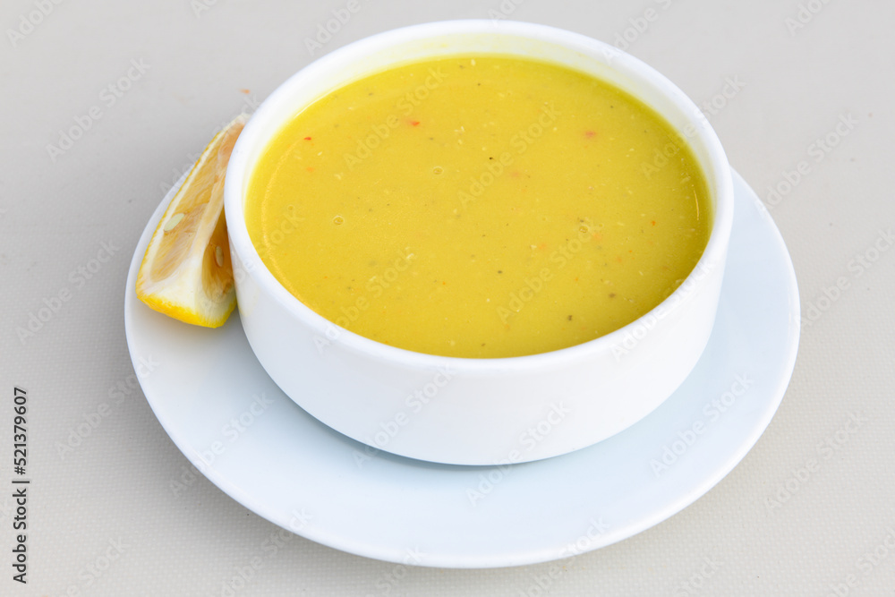 Lentil ( mercimek ) soup with melted butter and red pepper sauce Lentil ( mercimek ) soup with melted butter and red pepper sauce