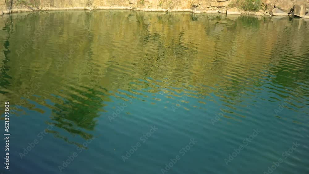 Flooded granite quarry. Beautiful nature around Flooded granite quarry. Beautiful nature around