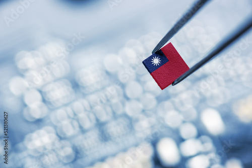 Flag of the Republic of China or Taiwan on a processor, CPU Central processing Unit or GPU microchip on a motherboard. Taiwan manufacturing chip industry emerges as battlefront in US - China showdown. photo