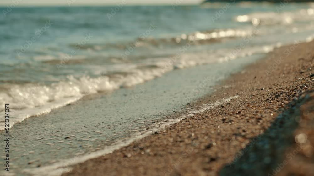 Sea waves washing over a sandy beach Sea waves washing over a sandy beach