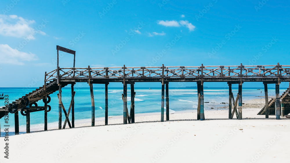 Wooden pier on Prison Island near Zanzibar. Beautiful turquoise water and white sand. Zanzibar. Tanzania