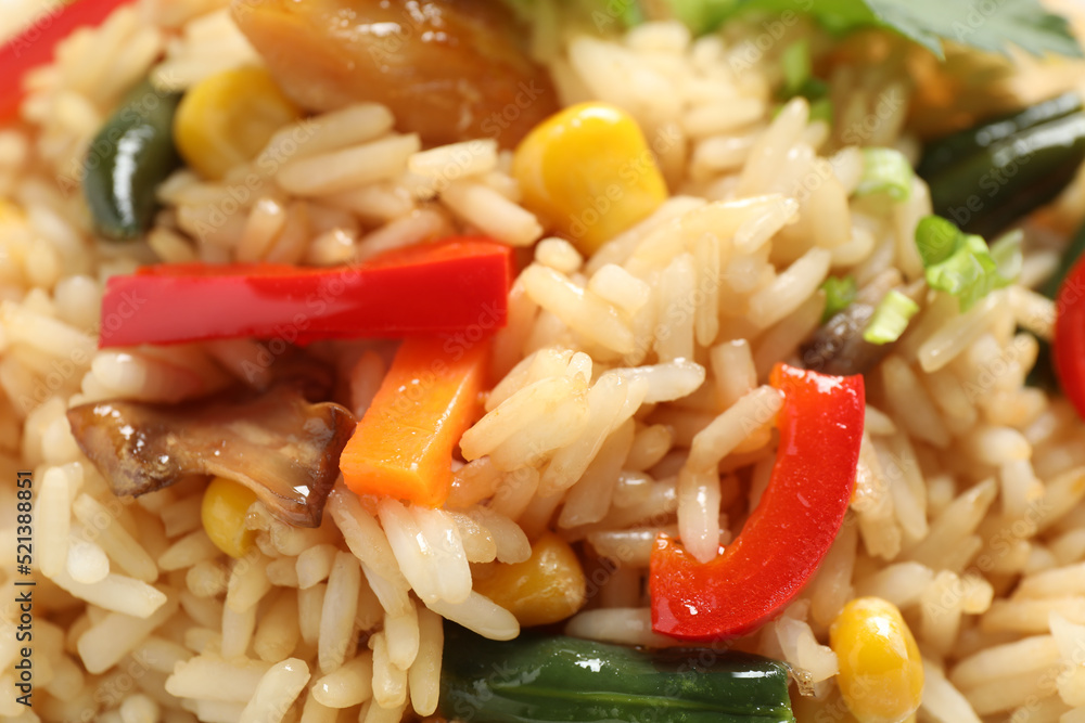 Delicious rice pilaf with vegetables as background, closeup Delicious rice pilaf with vegetables as background, closeup
