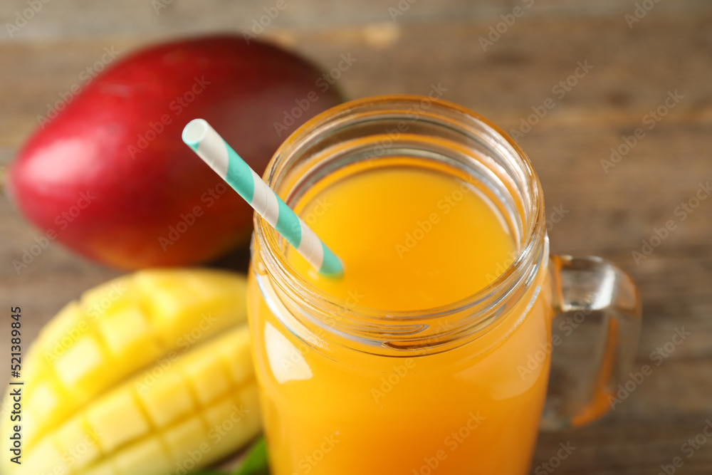 Fresh delicious mango drink on table, closeup Fresh delicious mango drink on table, closeup